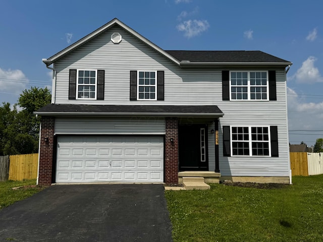 4227 Sestos Dr, Columbus, OH 43207 - traditional home featuring an attached garage, asphalt driveway, and brick siding