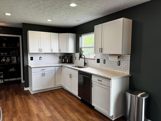 4227 Sestos Dr, Columbus, OH 43207 - kitchen featuring dishwasher, white cabinets, a textured ceiling, tasteful backsplash, and recessed lighting