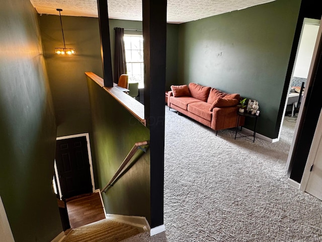 4227 Sestos Dr, Columbus, OH 43207 - staircase with carpet floors and a textured ceiling