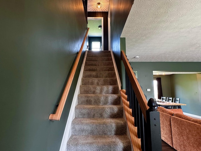 4227 Sestos Dr, Columbus, OH 43207 - staircase with a textured ceiling
