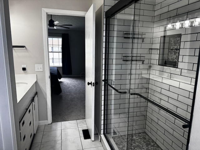 4227 Sestos Dr, Columbus, OH 43207 - ensuite bathroom featuring a stall shower, vanity, and ceiling fan