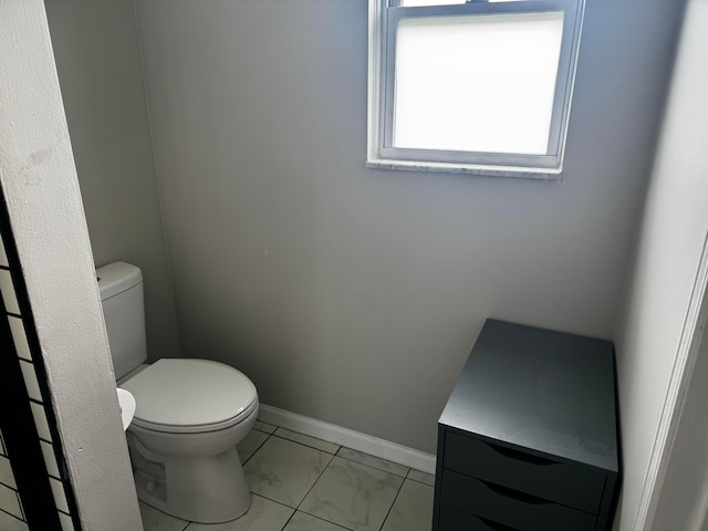 4227 Sestos Dr, Columbus, OH 43207 - bathroom with toilet and marble look tiles