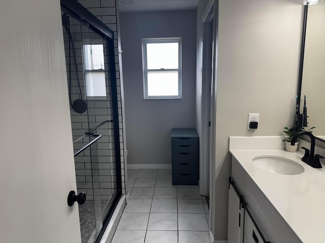 4227 Sestos Dr, Columbus, OH 43207 - full bathroom with marble look tile flooring, vanity, and a stall shower