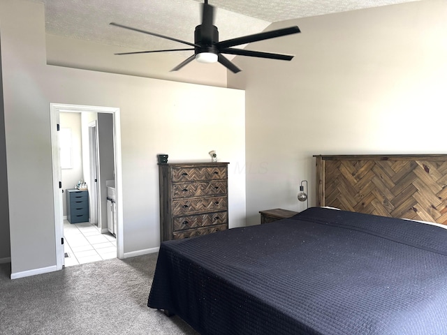 4227 Sestos Dr, Columbus, OH 43207 - carpeted bedroom featuring a ceiling fan, ensuite bath, a textured ceiling, and a towering ceiling