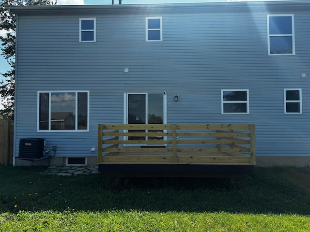 4227 Sestos Dr, Columbus, OH 43207 - rear view of house with a wooden deck and a yard