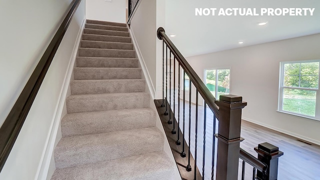 786 Sunny Vale Dr, Delaware, OH 43015 - staircase with recessed lighting, wood finished floors, and baseboards