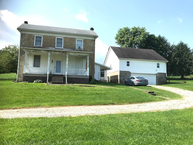 8023 County Road 30, Somerset, OH 43783 - view of front of property with a garage, covered porch, dirt driveway, and a front lawn