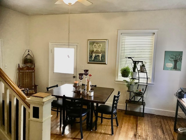 8023 County Road 30, Somerset, OH 43783 - dining area with hardwood / wood-style floors, a ceiling fan, and baseboards