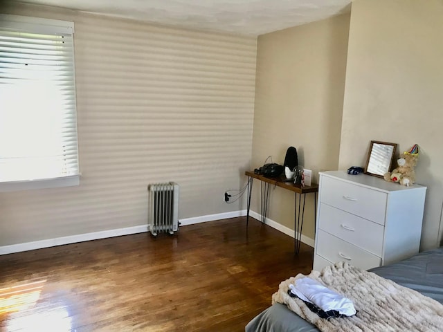8023 County Road 30, Somerset, OH 43783 - bedroom featuring radiator, dark wood finished floors, and baseboards