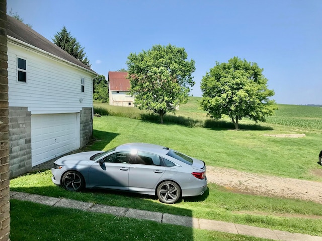 8023 County Road 30, Somerset, OH 43783 - view of grassy yard featuring a garage and driveway