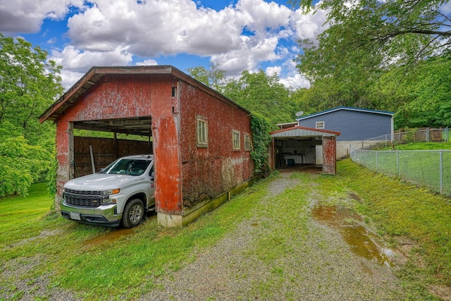 4137 Dry Run Rd, Chillicothe, OH 45601 - view of property exterior featuring an outbuilding, a garage, and driveway