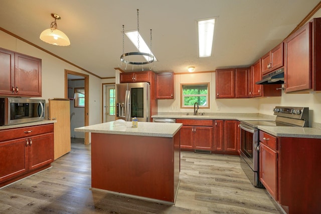 4137 Dry Run Rd, Chillicothe, OH 45601 - kitchen with stainless steel appliances, crown molding, under cabinet range hood, dark brown cabinets, and light wood-style floors