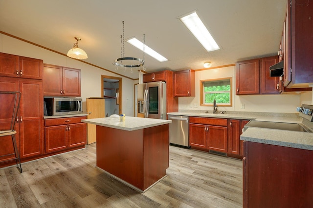 4137 Dry Run Rd, Chillicothe, OH 45601 - kitchen with stainless steel appliances, lofted ceiling, under cabinet range hood, light wood-style floors, and a center island