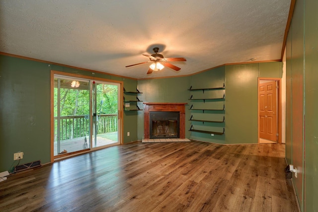 4137 Dry Run Rd, Chillicothe, OH 45601 - unfurnished living room featuring a textured ceiling, a ceiling fan, wood finished floors, ornamental molding, and a fireplace with flush hearth