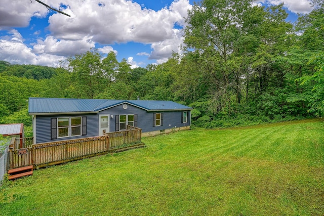 4137 Dry Run Rd, Chillicothe, OH 45601 - view of front of home featuring a front yard, a metal roof, a wooden deck, and a view of trees