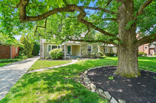 33 W Dominion Blvd, Columbus, OH 43214 - obstructed view of property featuring a front lawn and stone siding