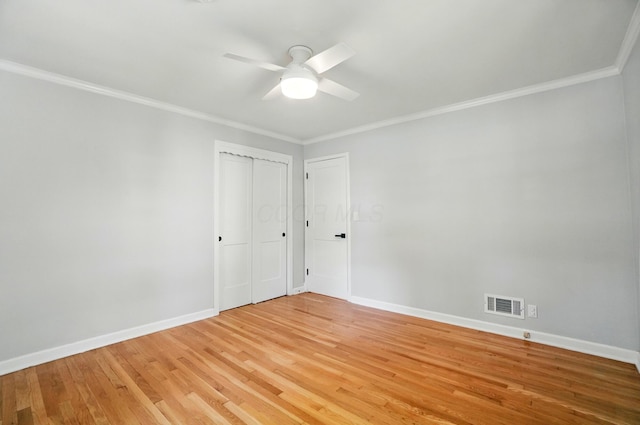 33 W Dominion Blvd, Columbus, OH 43214 - unfurnished bedroom featuring ornamental molding, light wood-style floors, ceiling fan, and a closet