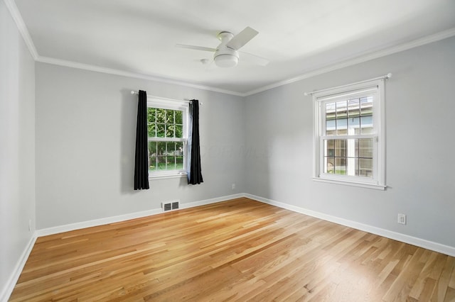 33 W Dominion Blvd, Columbus, OH 43214 - unfurnished room with ornamental molding, healthy amount of natural light, light wood-type flooring, and a ceiling fan