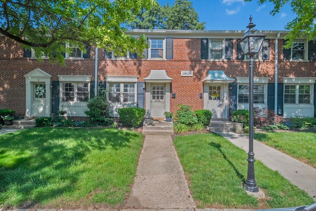 1809 NW Ct Unit C, Columbus, OH 43212 - townhome / multi-family property with a front lawn and brick siding