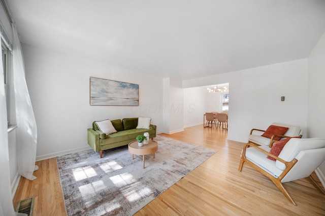 1809 NW Ct Unit C, Columbus, OH 43212 - living room with a chandelier and light wood-type flooring