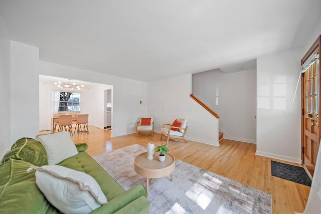 1809 NW Ct Unit C, Columbus, OH 43212 - living area with a chandelier, wood finished floors, and stairs
