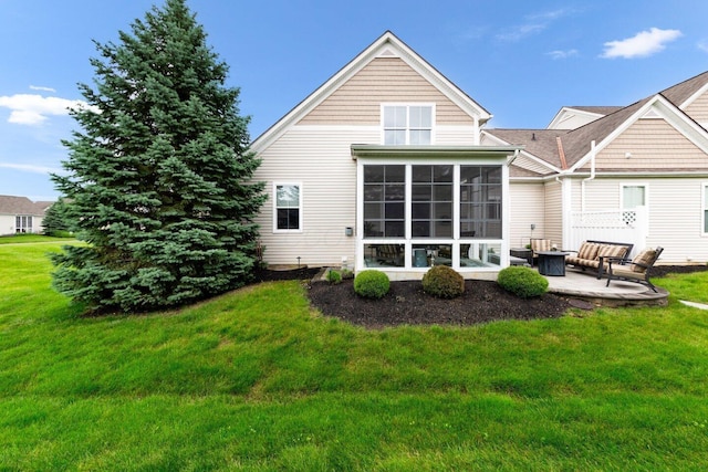 4724 Trademark Trl, Hilliard, OH 43026 - rear view of property with a patio, a lawn, and a sunroom