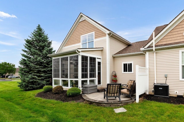 4724 Trademark Trl, Hilliard, OH 43026 - back of property featuring a sunroom, central AC, a yard, a shingled roof, and a patio area
