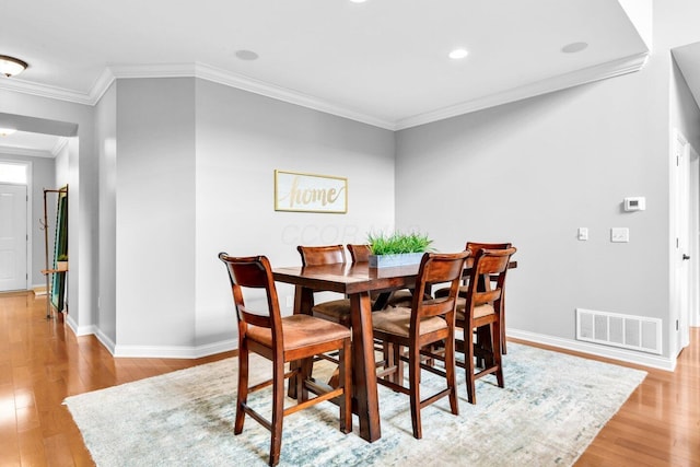 4724 Trademark Trl, Hilliard, OH 43026 - dining space with light wood finished floors, ornamental molding, baseboards, and recessed lighting