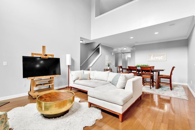 4724 Trademark Trl, Hilliard, OH 43026 - living area featuring crown molding, baseboards, wood finished floors, stairway, and recessed lighting