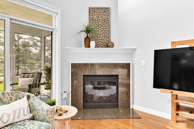 4724 Trademark Trl, Hilliard, OH 43026 - living area with a premium fireplace, baseboards, and wood finished floors