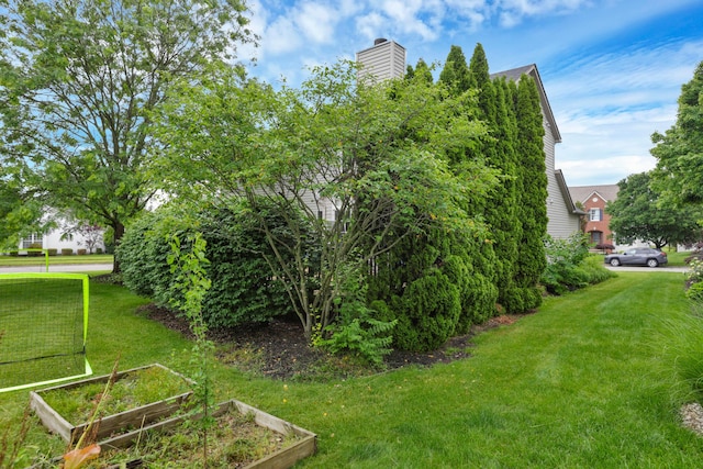6579 Clay Ct E, Canal Winchester, OH 43110 - view of grassy yard featuring a vegetable garden