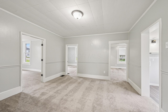 45 S Main St, New Holland, OH 43145 - spare room featuring crown molding, carpet flooring, and baseboards