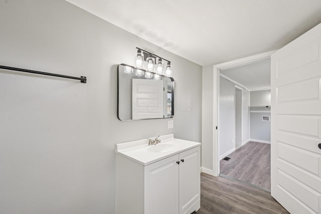 45 S Main St, New Holland, OH 43145 - bathroom with vanity, wood finished floors, and baseboards
