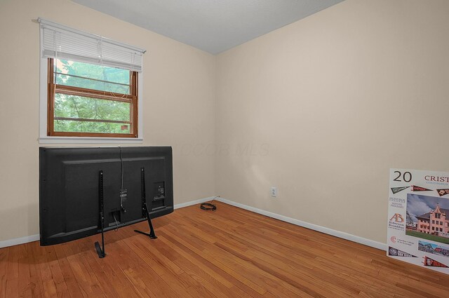 5990 Roselawn Ave, Columbus, OH 43232 - spare room featuring wood finished floors and baseboards