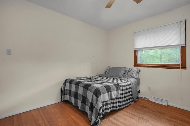 5990 Roselawn Ave, Columbus, OH 43232 - bedroom featuring baseboards, wood finished floors, and ceiling fan