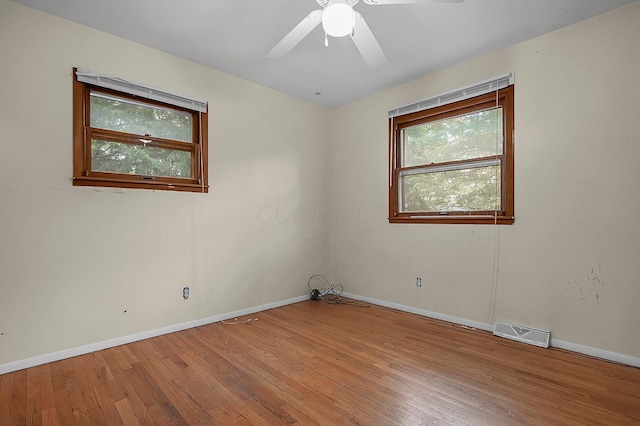 5990 Roselawn Ave, Columbus, OH 43232 - empty room featuring baseboards, hardwood / wood-style floors, and a ceiling fan