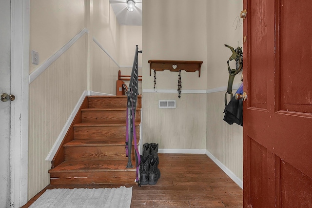 5990 Roselawn Ave, Columbus, OH 43232 - stairway featuring hardwood / wood-style flooring and a wainscoted wall