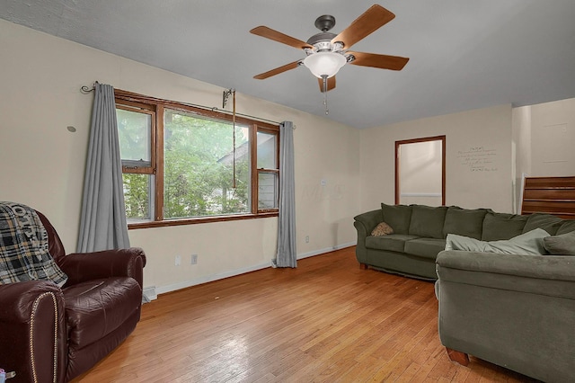 5990 Roselawn Ave, Columbus, OH 43232 - living area with ceiling fan, light wood-style flooring, and baseboards