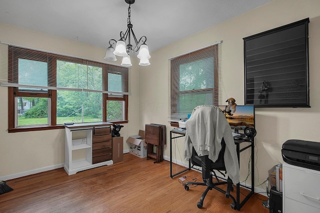 5990 Roselawn Ave, Columbus, OH 43232 - office space featuring light wood-type flooring, a chandelier, and baseboards