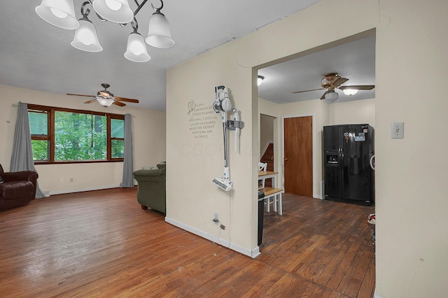 5990 Roselawn Ave, Columbus, OH 43232 - hall with wood-type flooring, a chandelier, and baseboards