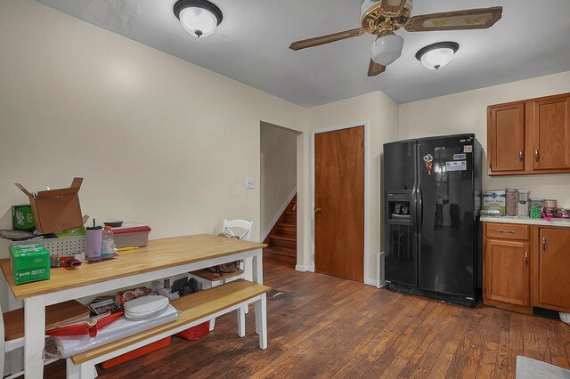 5990 Roselawn Ave, Columbus, OH 43232 - kitchen featuring black fridge, brown cabinetry, a ceiling fan, dark wood-style flooring, and light countertops