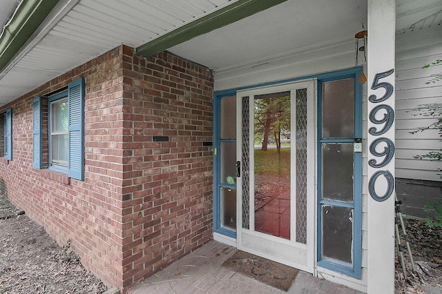 5990 Roselawn Ave, Columbus, OH 43232 - view of exterior entry featuring brick siding