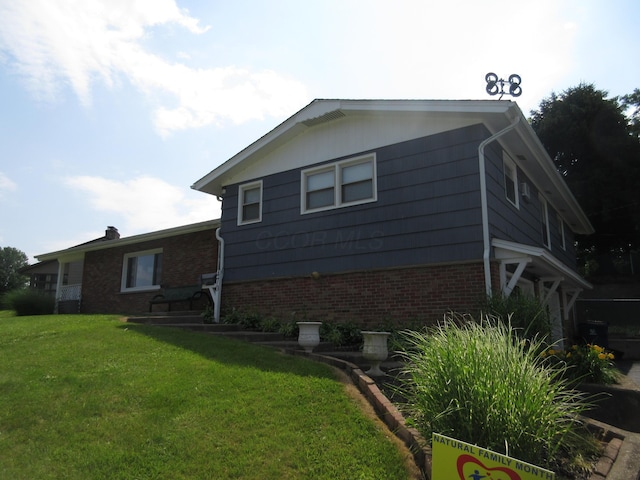 470 Beacon Rd, Newark, OH 43055 - view of property exterior featuring brick siding and a yard