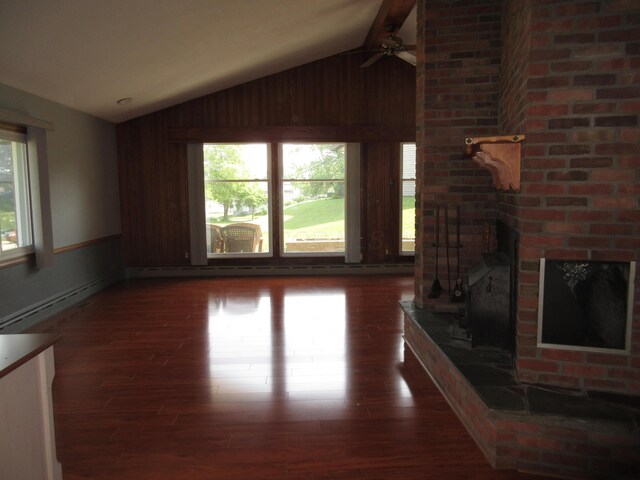 470 Beacon Rd, Newark, OH 43055 - living area featuring lofted ceiling, wood finished floors, a ceiling fan, wood walls, and a fireplace