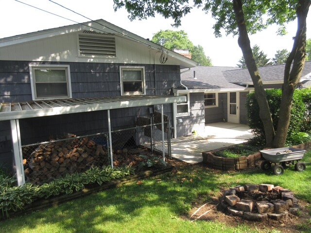 470 Beacon Rd, Newark, OH 43055 - rear view of house featuring a fire pit, a patio area, and a chimney