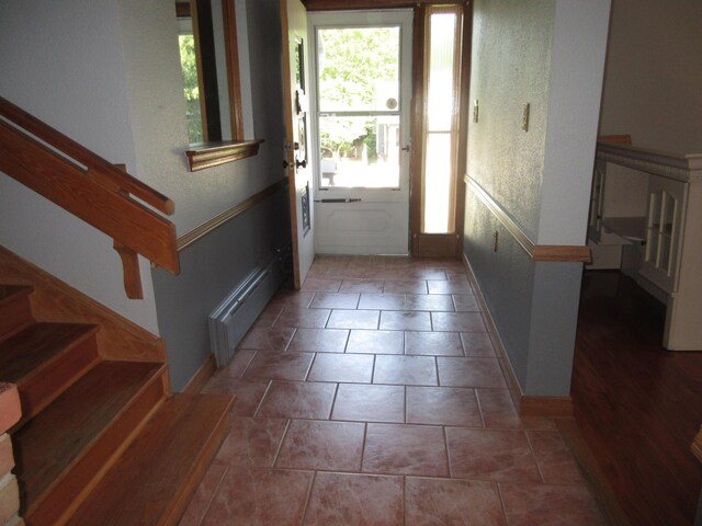 470 Beacon Rd, Newark, OH 43055 - entryway featuring plenty of natural light, stairs, radiator heating unit, and baseboards