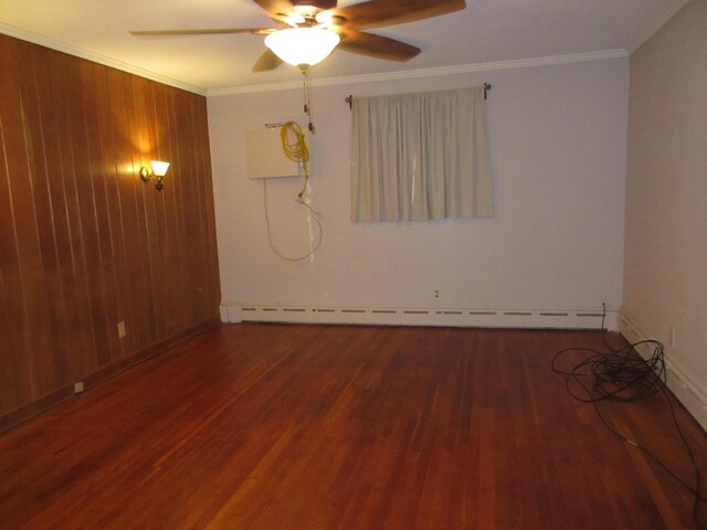 470 Beacon Rd, Newark, OH 43055 - spare room featuring wood finished floors, a ceiling fan, a baseboard radiator, crown molding, and baseboards