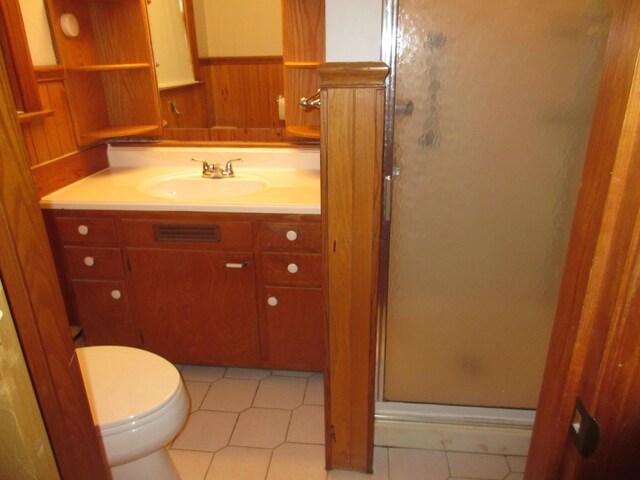 470 Beacon Rd, Newark, OH 43055 - bathroom featuring a shower stall, vanity, toilet, tile patterned floors, and wooden walls