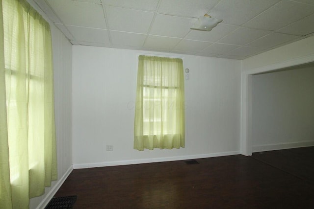552 Southwood Ave, Columbus, OH 43207 - empty room with dark wood-type flooring and a paneled ceiling