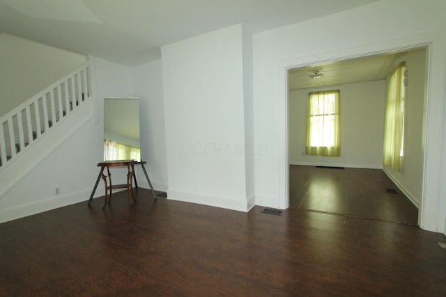 552 Southwood Ave, Columbus, OH 43207 - empty room featuring plenty of natural light, wood finished floors, and stairway
